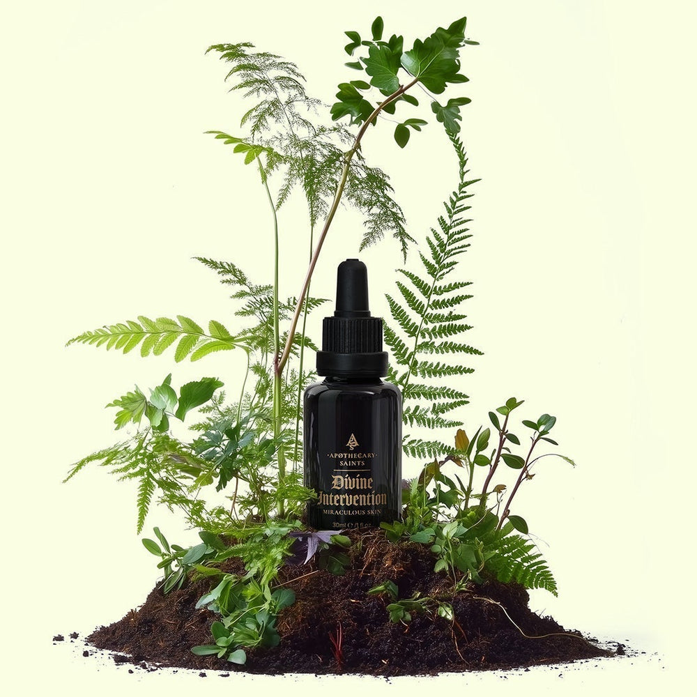 Divine Intervention bottle with botanicals growing around it