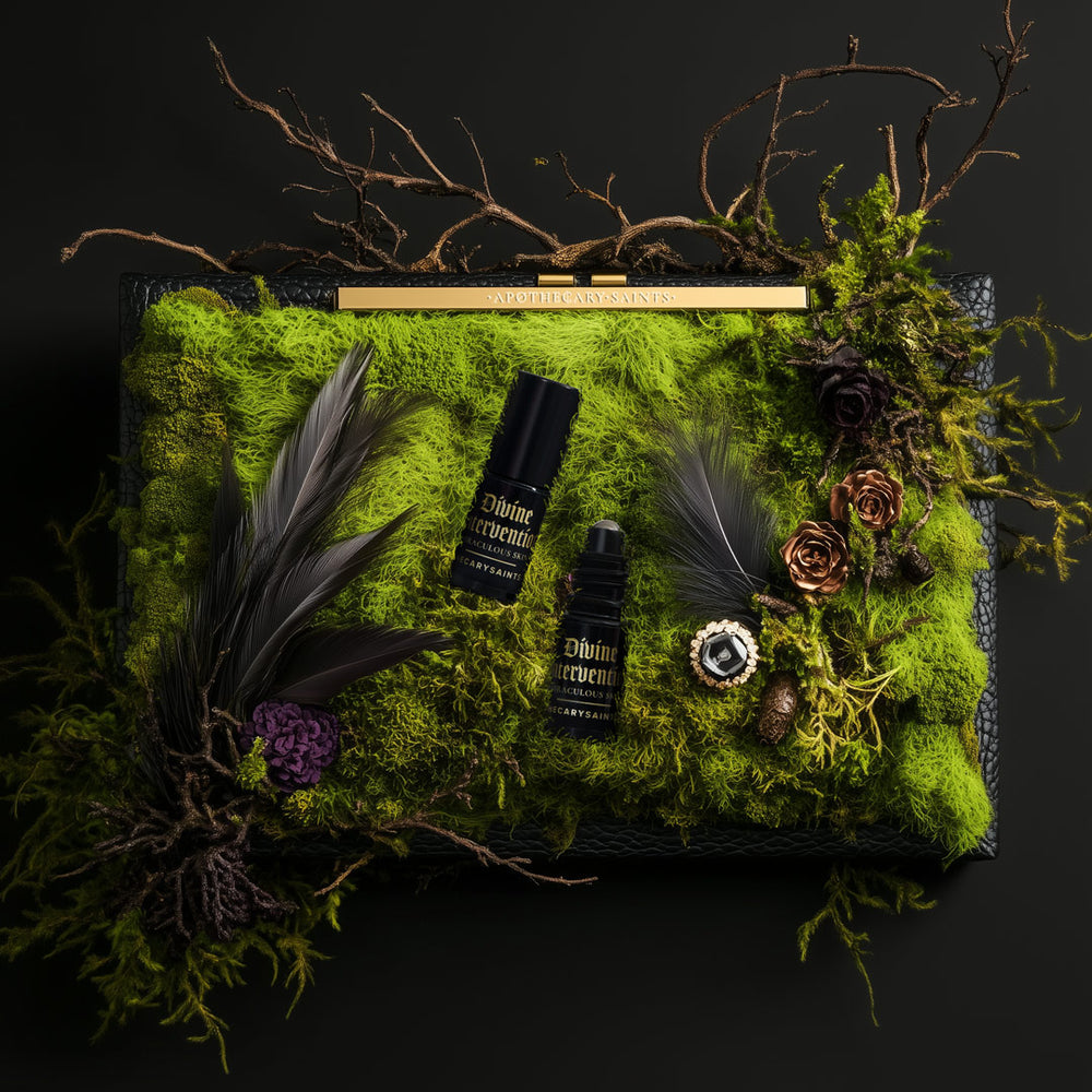 divine intervention 5ml roller bottles on moss-covered clutch bag