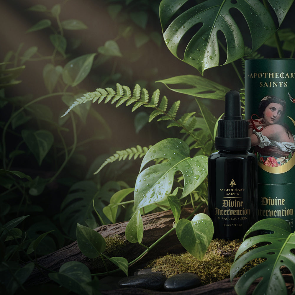 Bottle and packaging of Divine Intervention face oil in a natural background